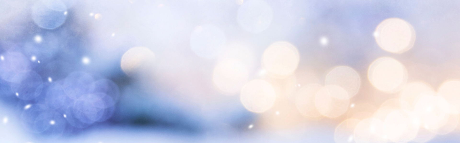 A laptop on the grass and a person's hand typing