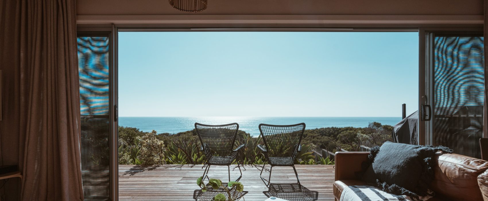 Terrace of modern villa overlooking ocean