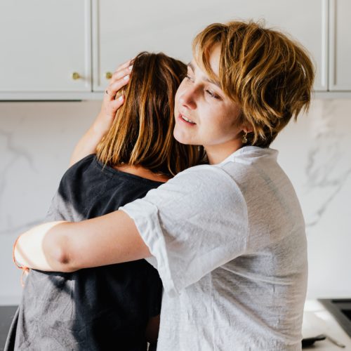 Two woman hugging